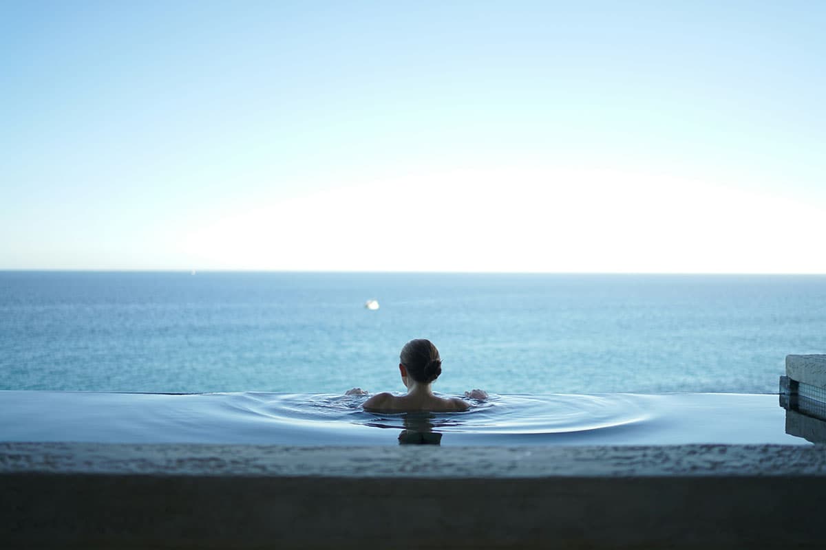 Woman in an infinity pool